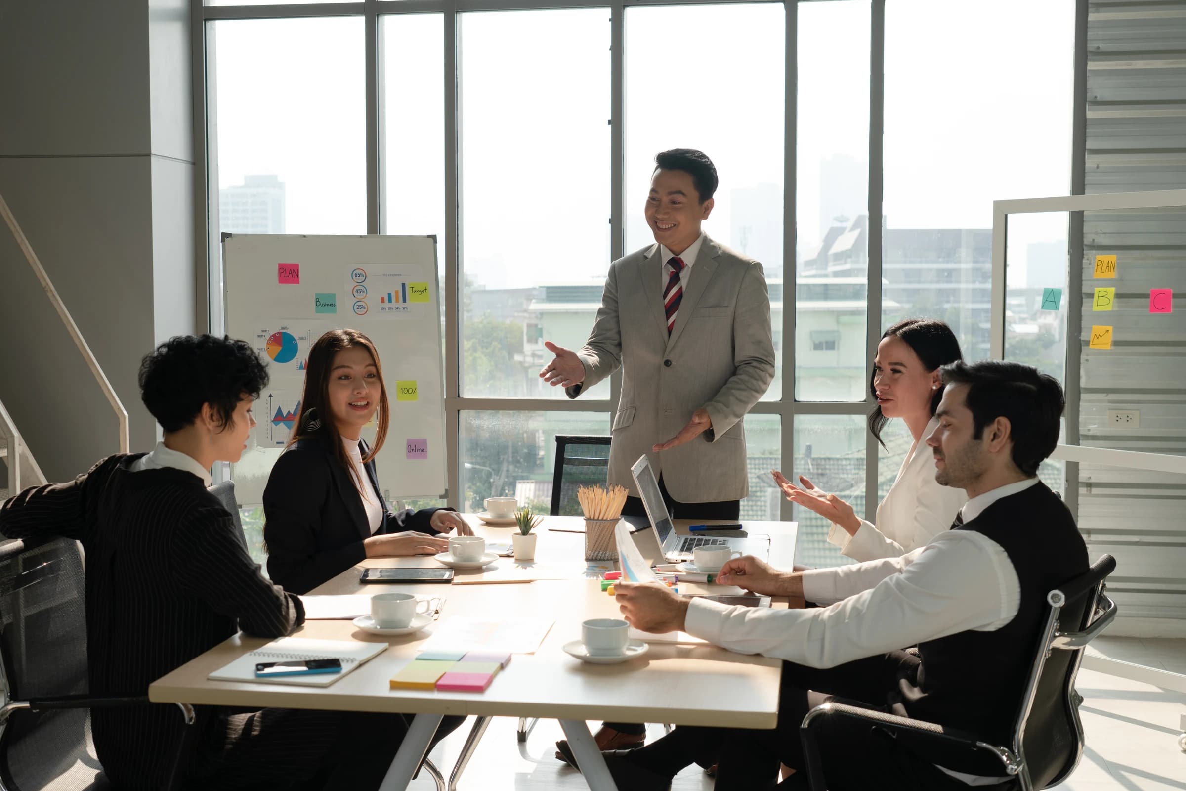 A manager discussing a project with a multiethnic team
